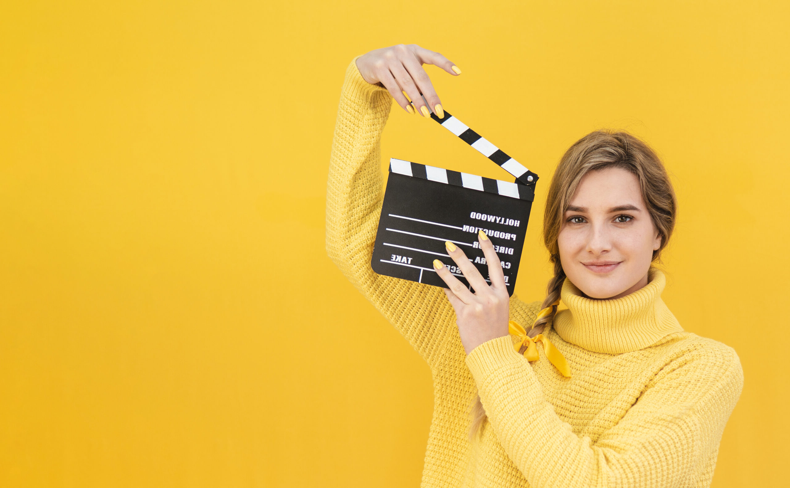 woman-holding-clapboard-with-copy-space